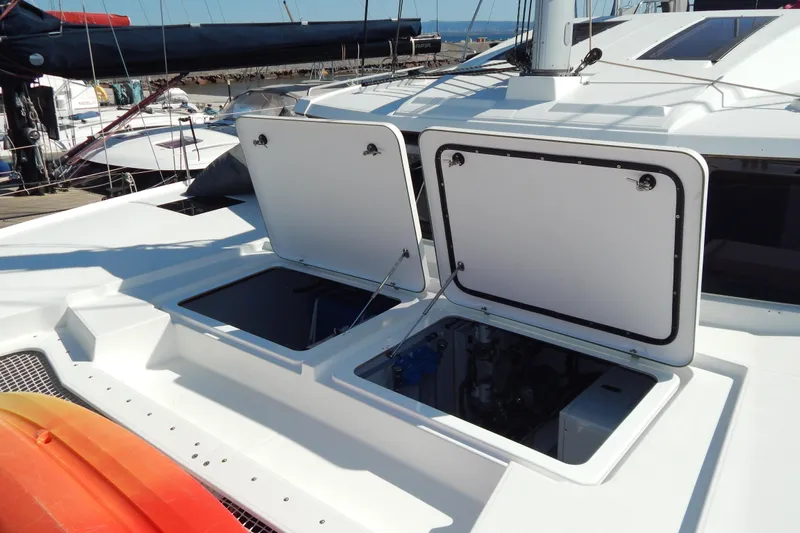  Yacht Photos Pics 2023 Fountaine Pajot Catamaran Elba 45 deck with open storage compartments.