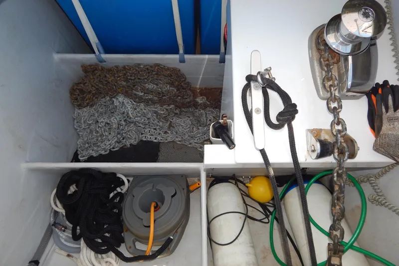  Yacht Photos Pics Storage compartment of 2023 Fountaine Pajot Catamaran Elba 45 with chains, ropes, and equipment.