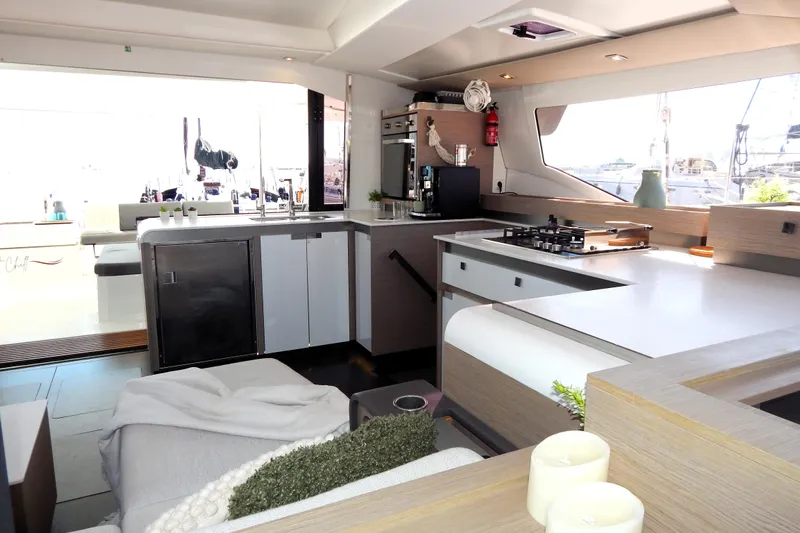  Yacht Photos Pics Modern kitchen interior of 2023 Fountaine Pajot Catamaran Elba 45 with sleek design elements.