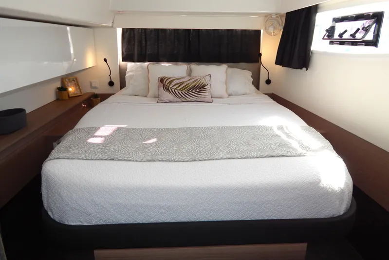  Yacht Photos Pics Luxurious bedroom interior of 2023 Fountaine Pajot Catamaran Elba 45 with modern decor.