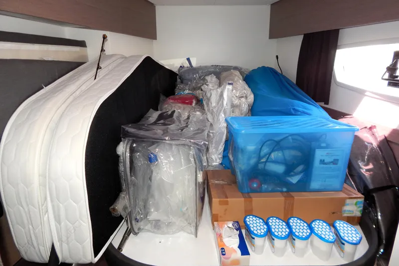  Yacht Photos Pics Interior storage area of 2023 Fountaine Pajot Catamaran Elba 45, filled with various items.