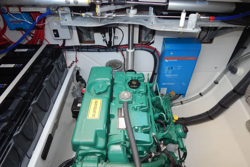  Yacht Photos Pics Engine room of 2023 Fountaine Pajot Catamaran Elba 45 with green engine and electrical components.