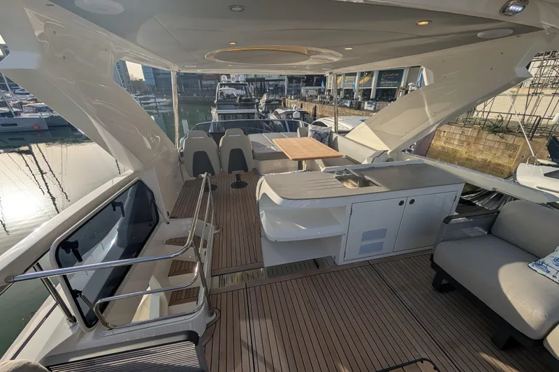  Yacht Photos Pics Luxurious 2025 Absolute 52 FLY yacht interior with elegant seating and modern amenities.