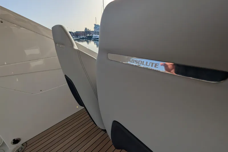  Yacht Photos Pics 2025 Absolute 52 FLY yacht interior with sleek seating and modern design.