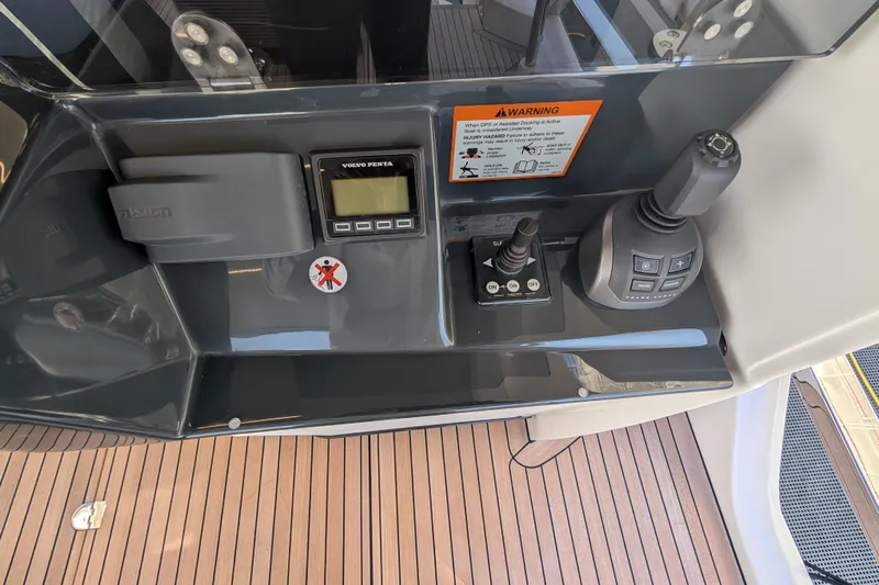  Yacht Photos Pics Control panel of 2025 Absolute 52 FLY yacht with joystick and display.