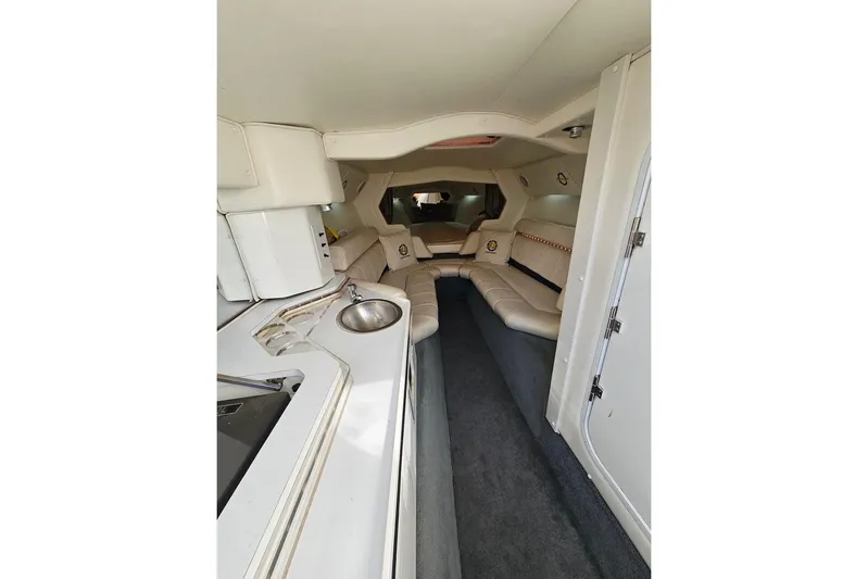  Yacht Photos Pics Luxurious interior of a 2004 Fountain 42 Lightning boat with plush seating and kitchenette.