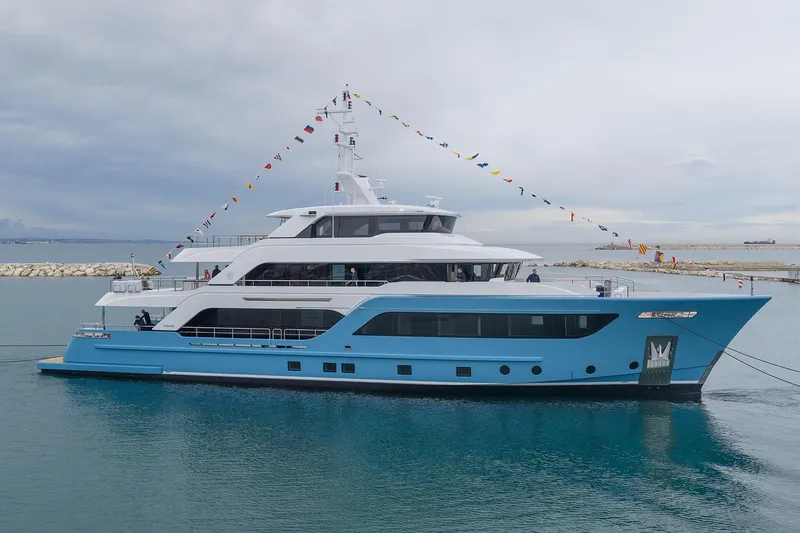 Presence Yacht Photos Pics Luxury yacht Cantiere Delle Marche Acciaio 130, 2026 model, docked with festive flags.