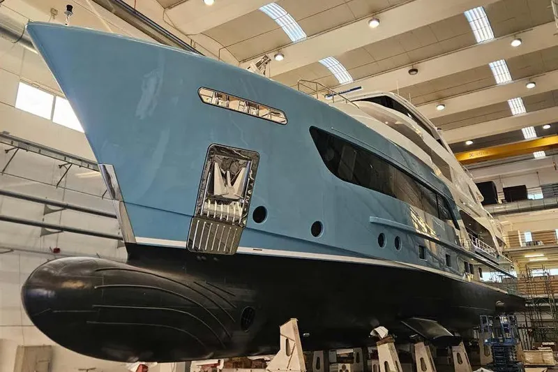 Presence Yacht Photos Pics 2026 Cantiere Delle Marche Acciaio 130 yacht in shipyard, blue hull, under construction.