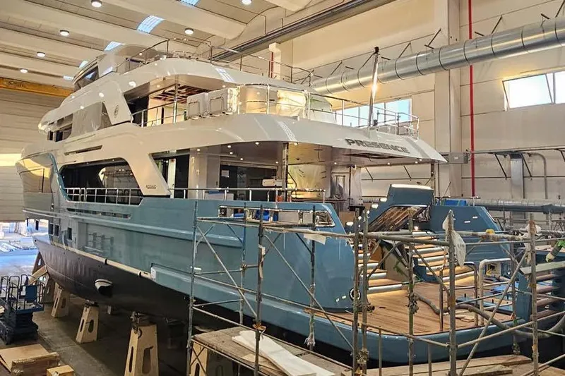 Presence Yacht Photos Pics Luxury yacht Cantiere Delle Marche Acciaio 130, 2026 model, under construction in a shipyard.