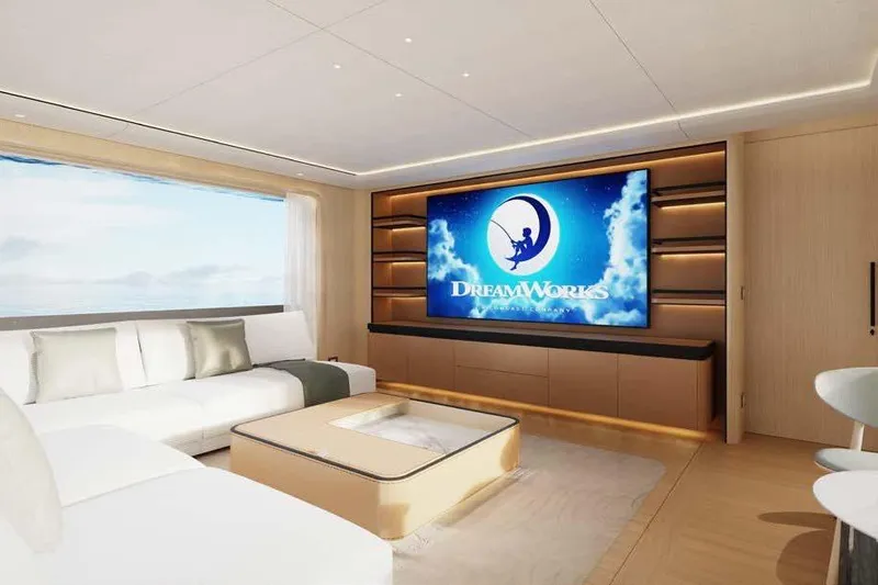 Presence Yacht Photos Pics Luxurious yacht interior of Cantiere Delle Marche Acciaio 130, featuring a large screen and elegant seating.