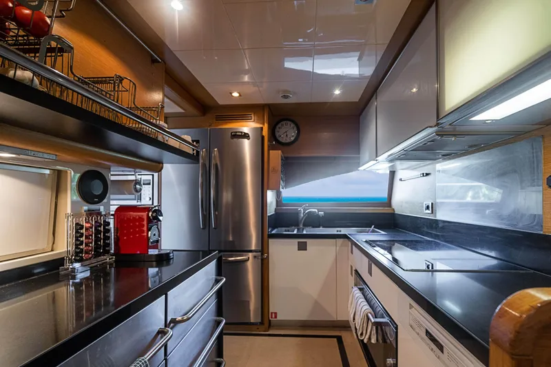 Patron Yacht Photos Pics Modern kitchen interior on 2008 Ferretti Yachts Custom, featuring sleek appliances and ample counter space.