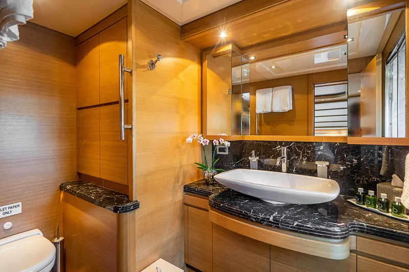 Patron Yacht Photos Pics Luxurious 2008 Ferretti Yachts Custom bathroom with elegant wood and marble finishes.