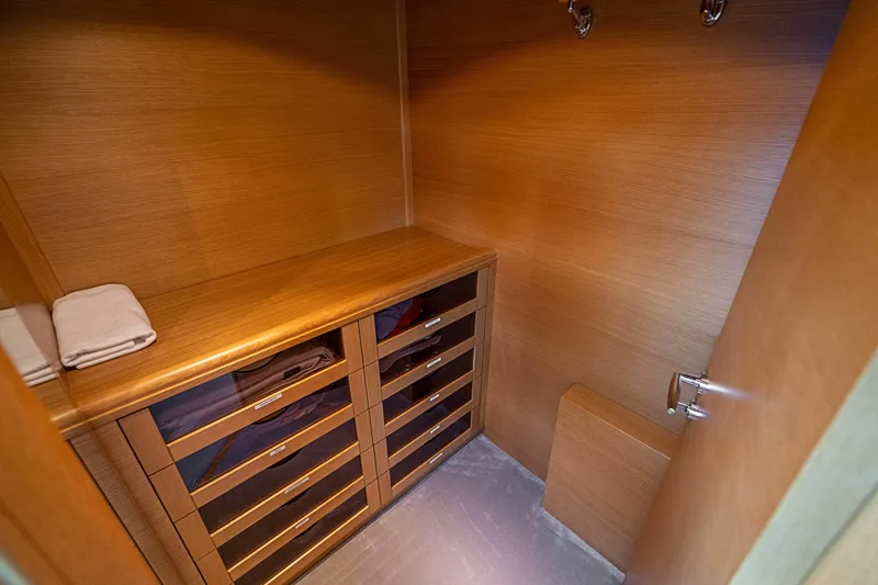 Patron Yacht Photos Pics Luxurious wooden closet interior on a 2008 Ferretti Yachts Custom model.