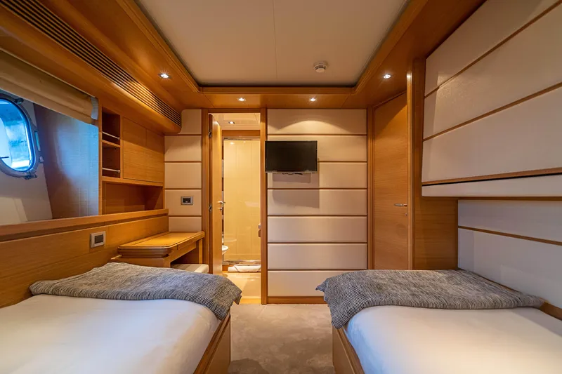 Patron Yacht Photos Pics Luxurious twin cabin interior on 2008 Ferretti Yachts Custom, featuring modern design and amenities.