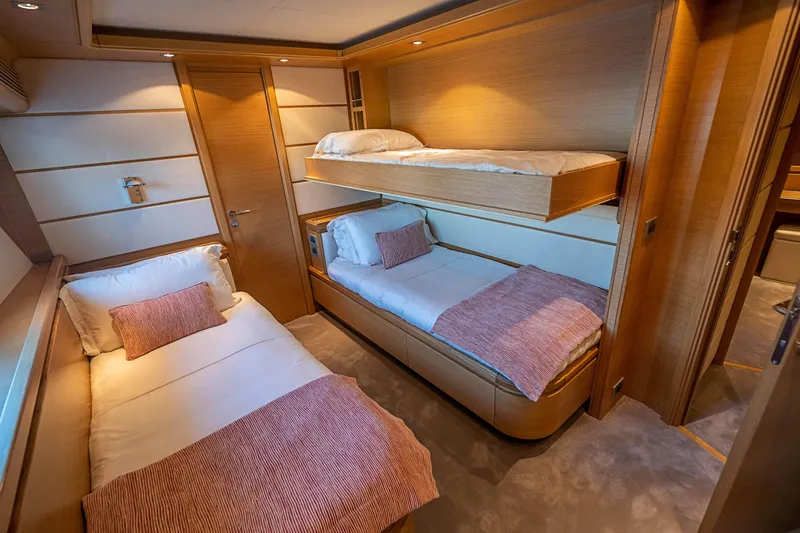 Patron Yacht Photos Pics Luxurious 2008 Ferretti Yachts Custom cabin with twin beds and elegant wood finish.