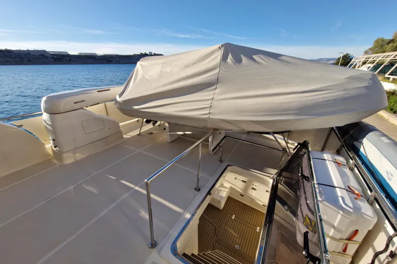 Mazu Yacht Photos Pics Adagio 58 yacht deck, 2011 model, with covered seating area by the water.