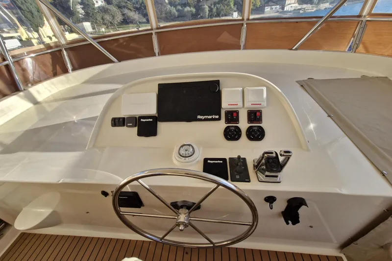 Mazu Yacht Photos Pics Helm of 2011 Adagio 58 yacht with navigation controls and steering wheel.