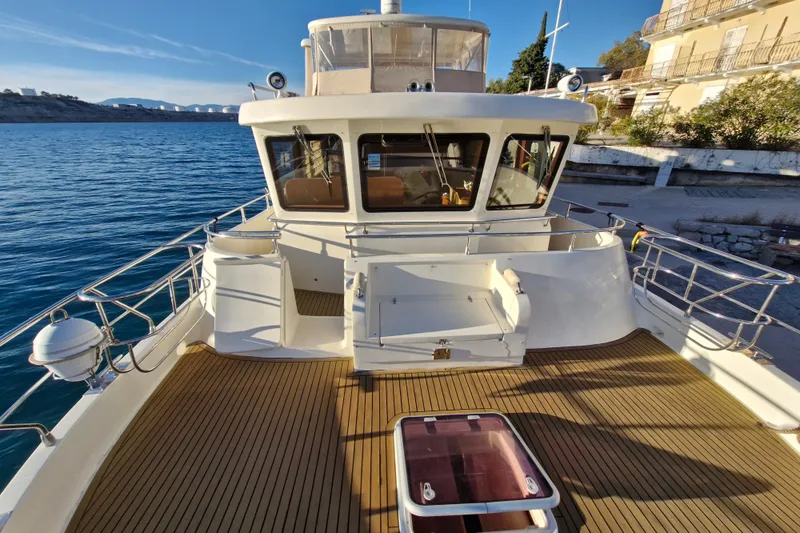 Mazu Yacht Photos Pics Luxurious 2011 Adagio 58 yacht with spacious deck and scenic waterfront view.