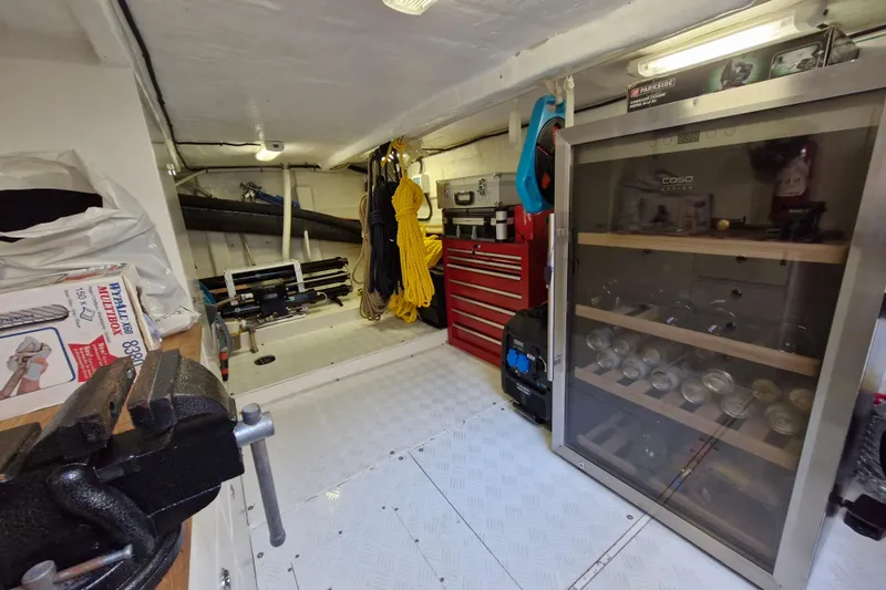 Mazu Yacht Photos Pics Engine room of a 2011 Adagio 58 yacht with tools and equipment neatly organized.