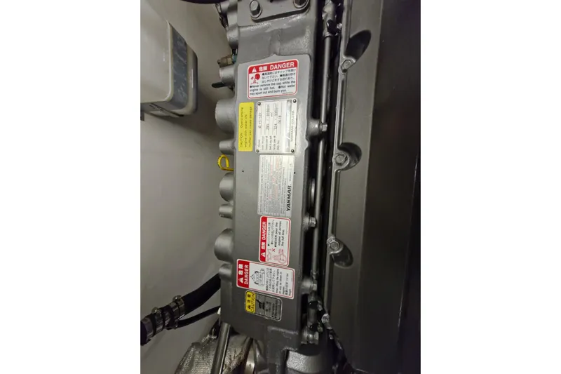 Mazu Yacht Photos Pics Engine with warning labels, Adagio 58, 2011 model, detailed view.