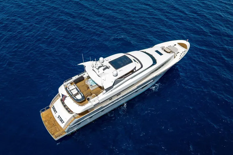 Short Story Yacht Photos Pics Aerial view of 2017 Horizon RP120 yacht cruising on deep blue ocean waters.
