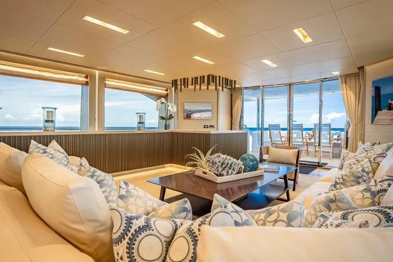 Short Story Yacht Photos Pics Luxurious Horizon RP120 yacht interior with ocean view, elegant decor, and plush seating, 2017 model.