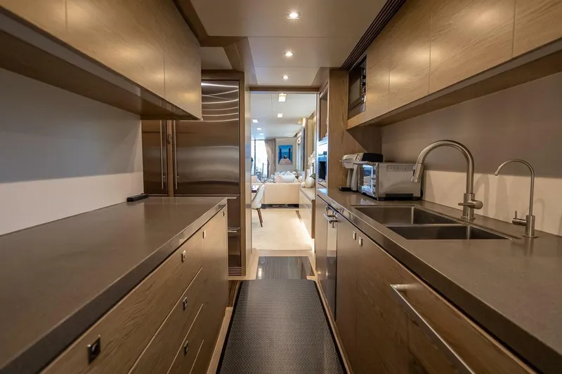 Short Story Yacht Photos Pics Luxurious galley kitchen on 2017 Horizon RP120 yacht with modern appliances and sleek design.