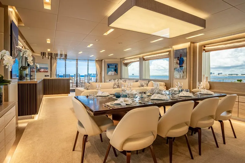 Short Story Yacht Photos Pics Luxurious dining area on 2017 Horizon RP120 yacht with elegant decor and ocean views.