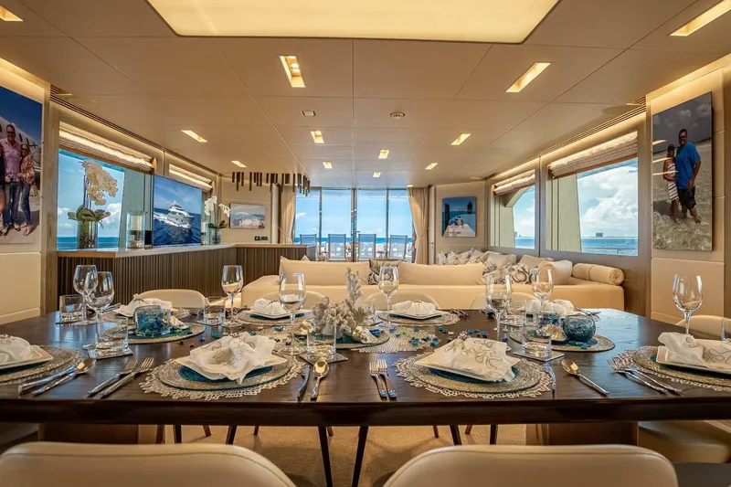 Short Story Yacht Photos Pics Luxurious dining area on 2017 Horizon RP120 yacht with elegant table setting and ocean views.