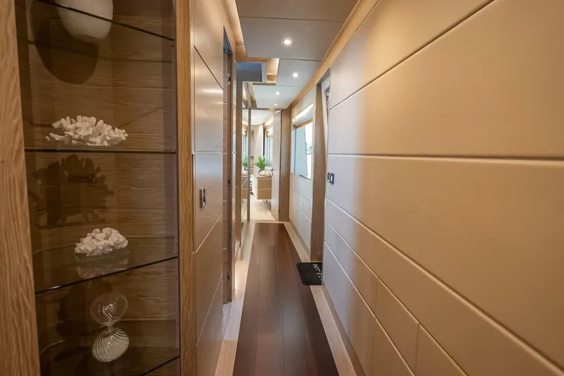 Short Story Yacht Photos Pics Luxurious hallway in 2017 Horizon RP120 yacht, featuring elegant decor and modern lighting.