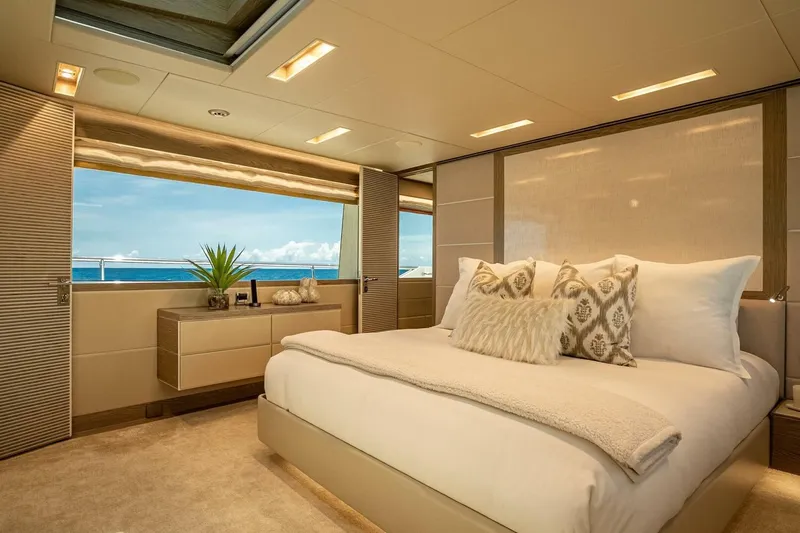 Short Story Yacht Photos Pics Luxurious bedroom on 2017 Horizon RP120 yacht with ocean view and elegant decor.
