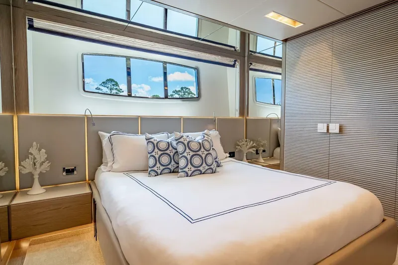 Short Story Yacht Photos Pics Luxurious bedroom interior on 2017 Horizon RP120 yacht with elegant decor and large windows.