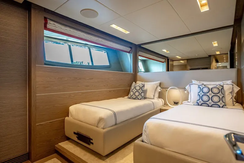 Short Story Yacht Photos Pics Luxurious twin bedroom in 2017 Horizon RP120 yacht with modern decor and large windows.
