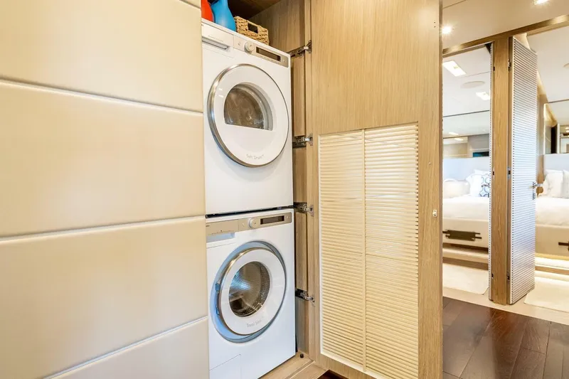 Short Story Yacht Photos Pics Stacked washer and dryer in a modern laundry area on a 2017 Horizon RP120 yacht.