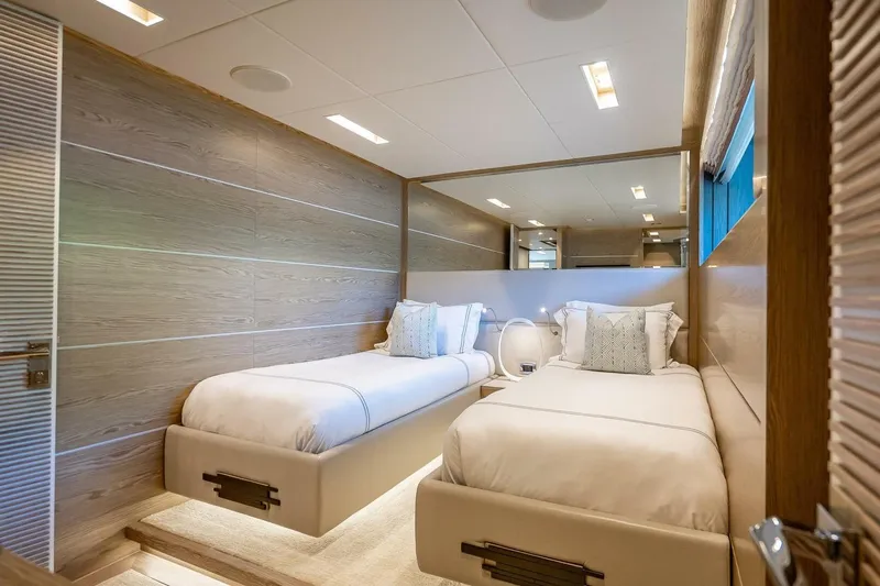 Short Story Yacht Photos Pics Luxurious twin bedroom in 2017 Horizon RP120 yacht, featuring modern design and elegant decor.