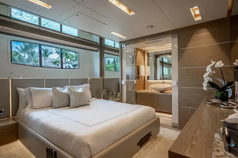 Short Story Yacht Photos Pics Luxurious bedroom and bathroom interior on 2017 Horizon RP120 yacht, featuring modern design.
