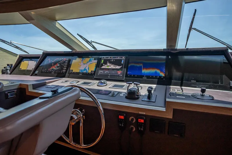 Short Story Yacht Photos Pics Control panel of a 2017 Horizon RP120 yacht with advanced navigation displays.