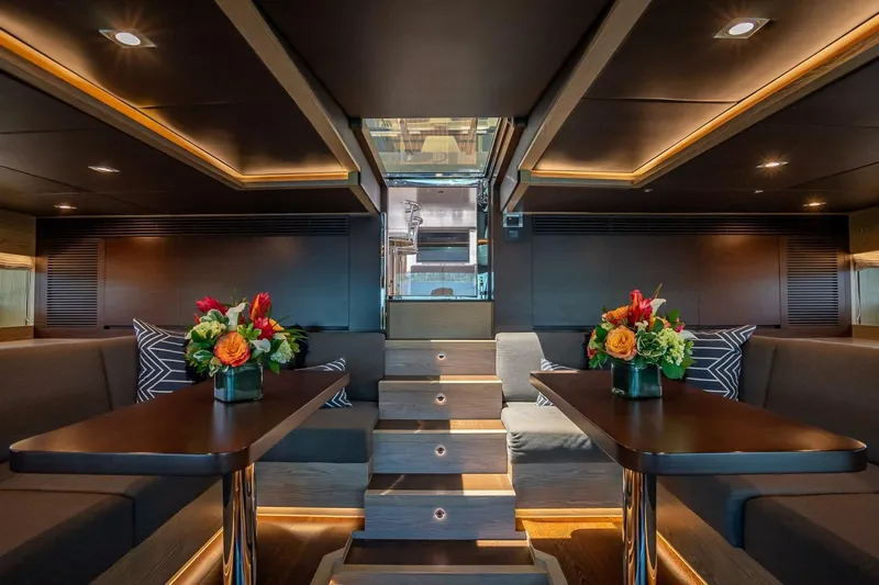 Short Story Yacht Photos Pics Luxurious interior of 2017 Horizon RP120 yacht with elegant seating and floral arrangements.