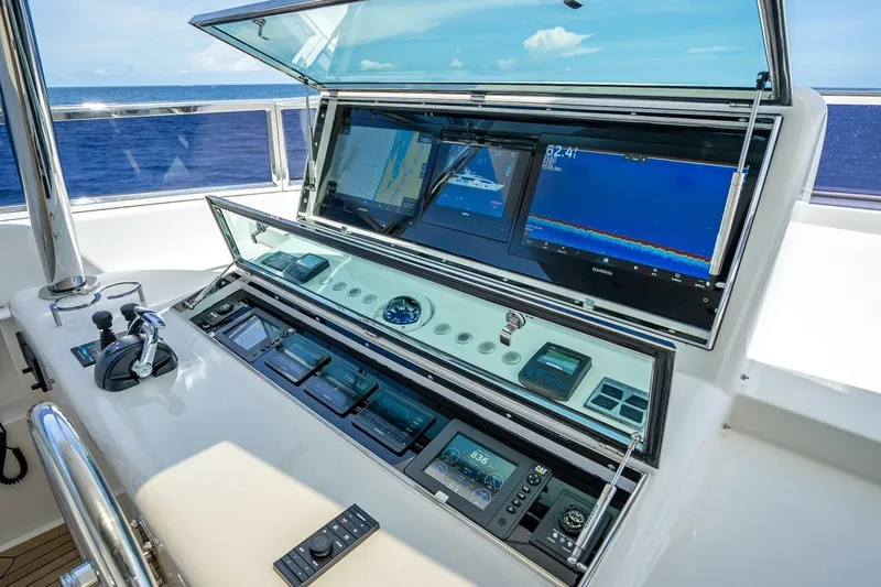 Short Story Yacht Photos Pics Control panel of 2017 Horizon RP120 yacht with navigation screens and controls.