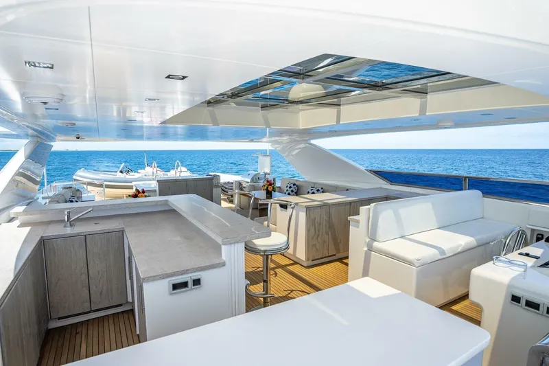 Short Story Yacht Photos Pics Luxurious Horizon RP120 yacht deck with modern seating and ocean view, 2017 model.