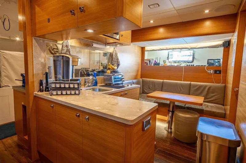 Short Story Yacht Photos Pics Luxurious Horizon RP120 yacht interior with modern kitchen and cozy dining area, 2017 model.