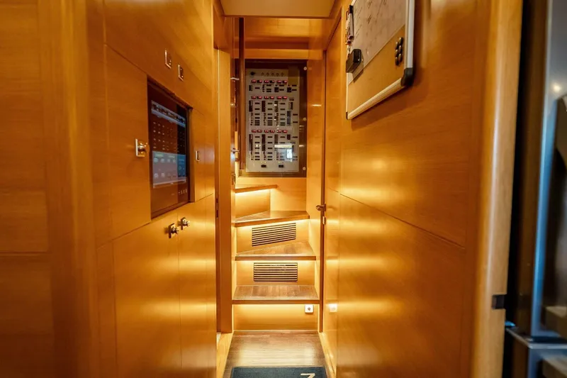 Short Story Yacht Photos Pics Luxurious wooden interior of 2017 Horizon RP120 yacht with illuminated stairs and control panel.