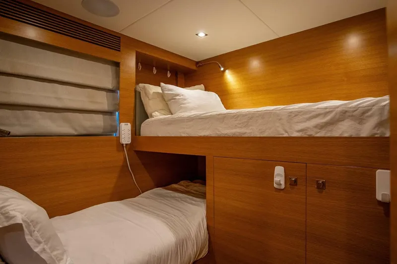 Short Story Yacht Photos Pics Bunk beds in a 2017 Horizon RP120 yacht cabin with wooden interior.