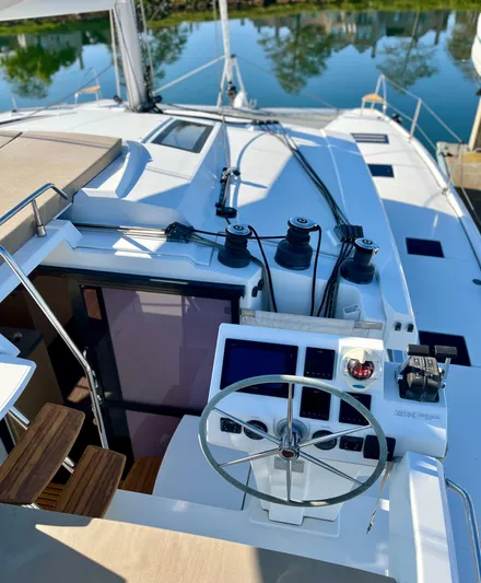 Bright Side Yacht Photos Pics Helm of 2019 Fountaine Pajot Saona 47 catamaran with modern navigation equipment.