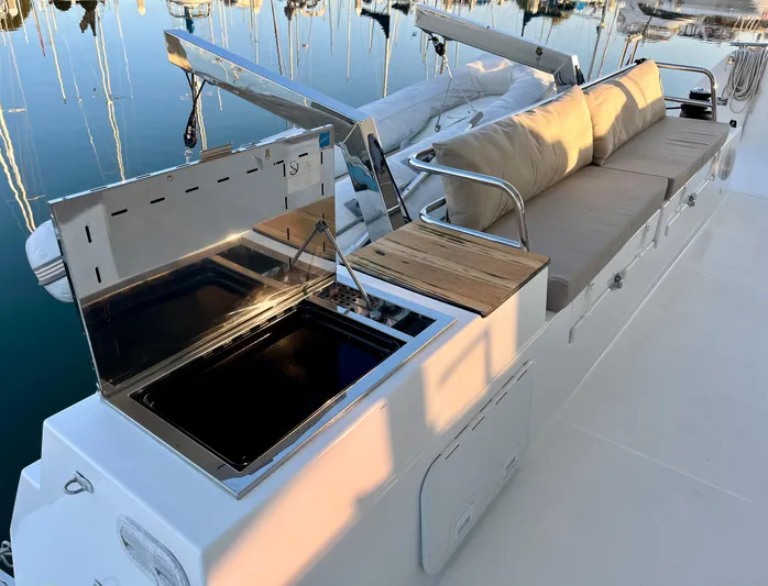 Bright Side Yacht Photos Pics 2019 Fountaine Pajot Saona 47 yacht deck with seating and outdoor kitchen.