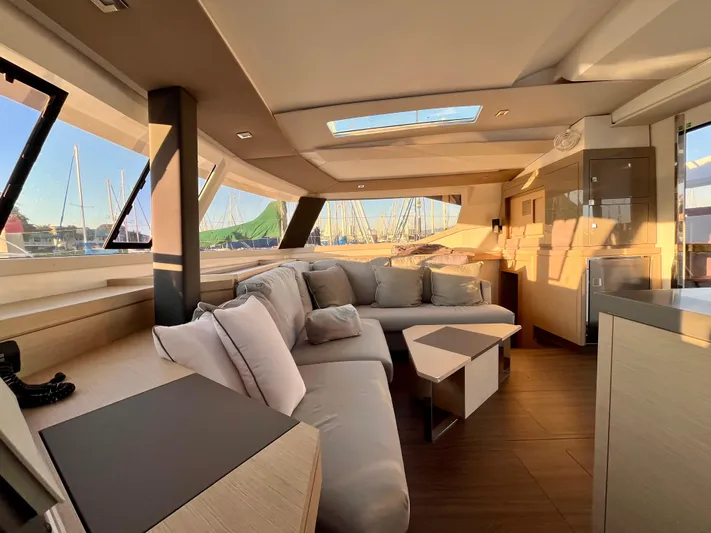 Bright Side Yacht Photos Pics Luxurious interior of 2019 Fountaine Pajot Saona 47 catamaran with modern furnishings.