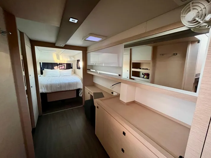Bright Side Yacht Photos Pics Luxurious interior of 2019 Fountaine Pajot Saona 47 catamaran with modern bedroom and sleek design.