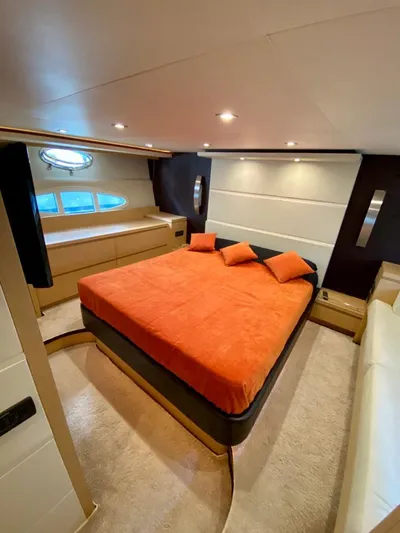 Yacht Photos Pics Luxurious bedroom in 2008 Uniesse 68 yacht with orange bedding and modern design.