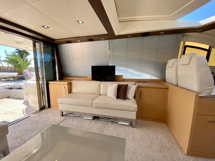  Yacht Photos Pics Luxurious interior of 2008 Uniesse 68 yacht with modern furnishings and natural light.