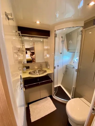  Yacht Photos Pics Luxurious bathroom in a 2008 Uniesse 68 yacht with modern fixtures and shower.